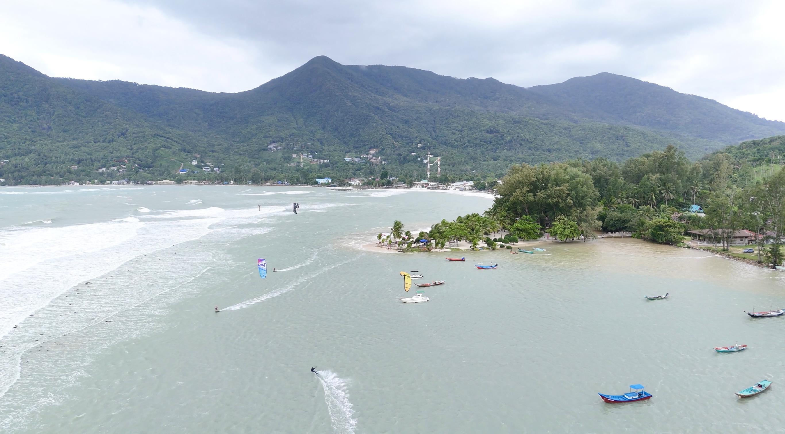 East side view of Chaloklum Beach with Siam Pro Kite Malibu station and mountain backdrop