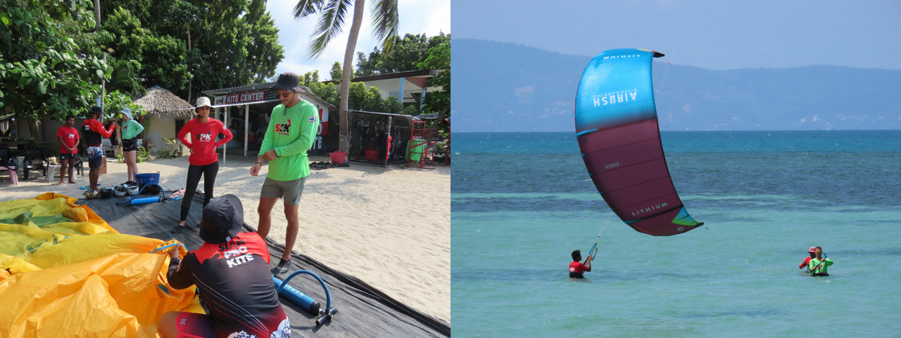 Students learning kitesurfing theory at Siam Pro Kite Koh Phangan Thailand beside a busy launch area with colorful kites in the background.