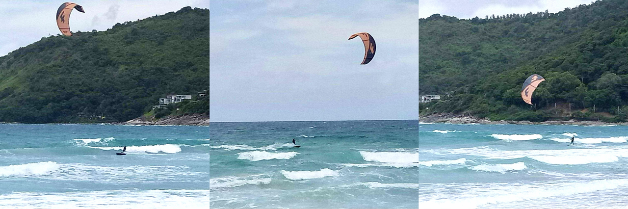 Kitesurfer riding ocean waves at Nai Harn Beach Thailand with tropical scenery and powerful surf conditions.
